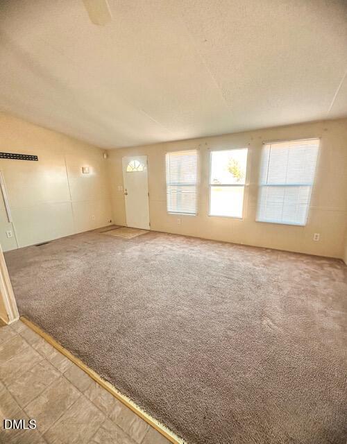 7537 Sam Young Road Oxford, NC 27565 - Photo 12 of 28 an empty room with windows