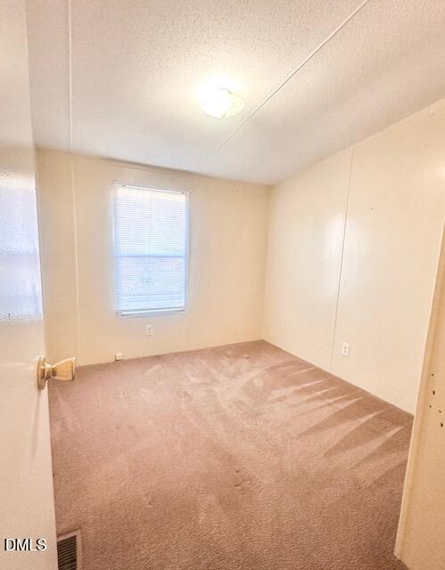7537 Sam Young Road Oxford, NC 27565 - Photo 19 of 28 an empty room with a empty space and a window
