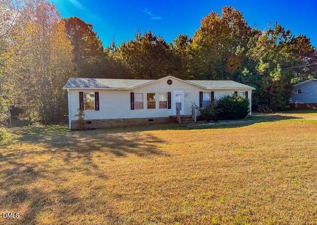 7537 Sam Young Road Oxford, NC 27565 - Photo 2 of 28 a front view of a house with a yard