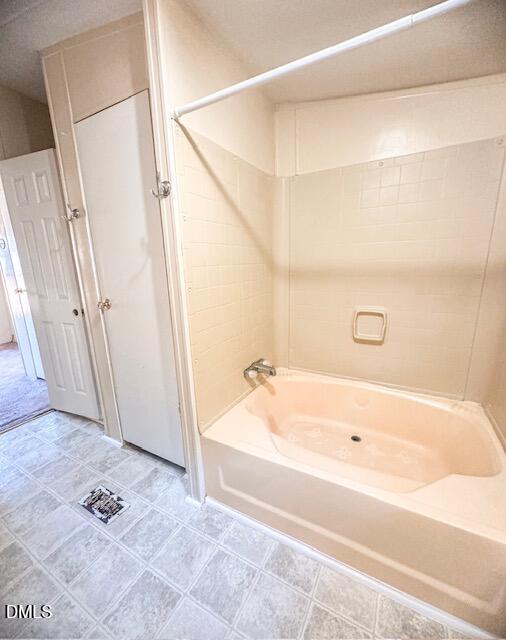 7537 Sam Young Road Oxford, NC 27565 - Photo 23 of 28 a bathroom with a bathtub and a shower