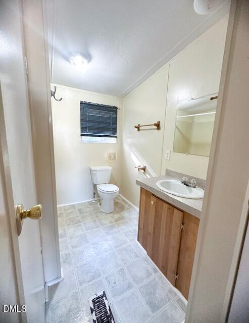 7537 Sam Young Road Oxford, NC 27565 - Photo 24 of 28 a bathroom with a sink a toilet and shower