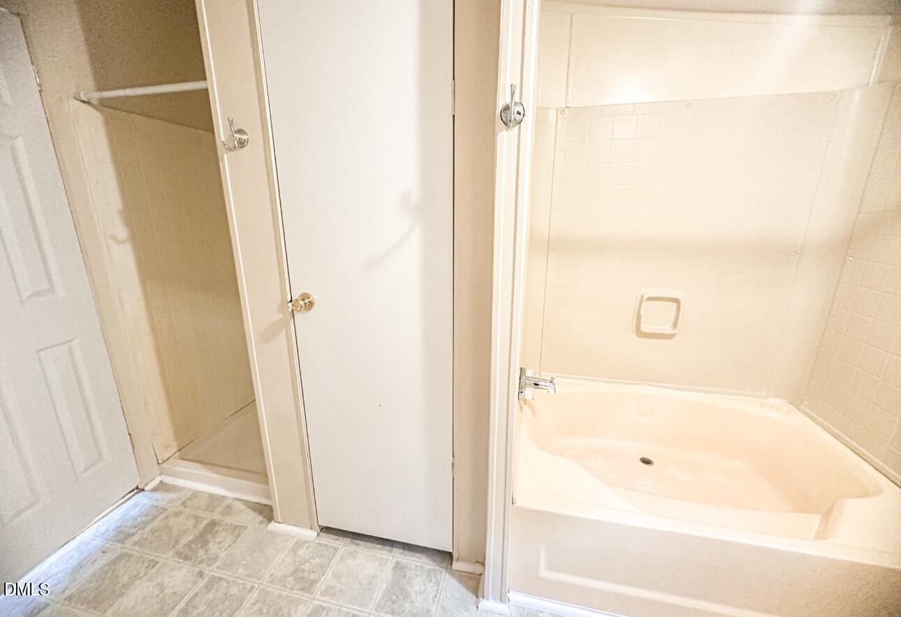 7537 Sam Young Road Oxford, NC 27565 - Photo 26 of 28 a bathroom with a bathtub