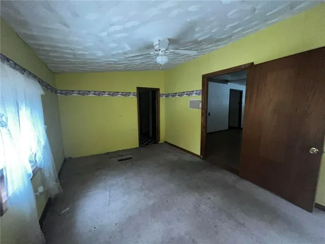 a bedroom with a black and white checkered floor