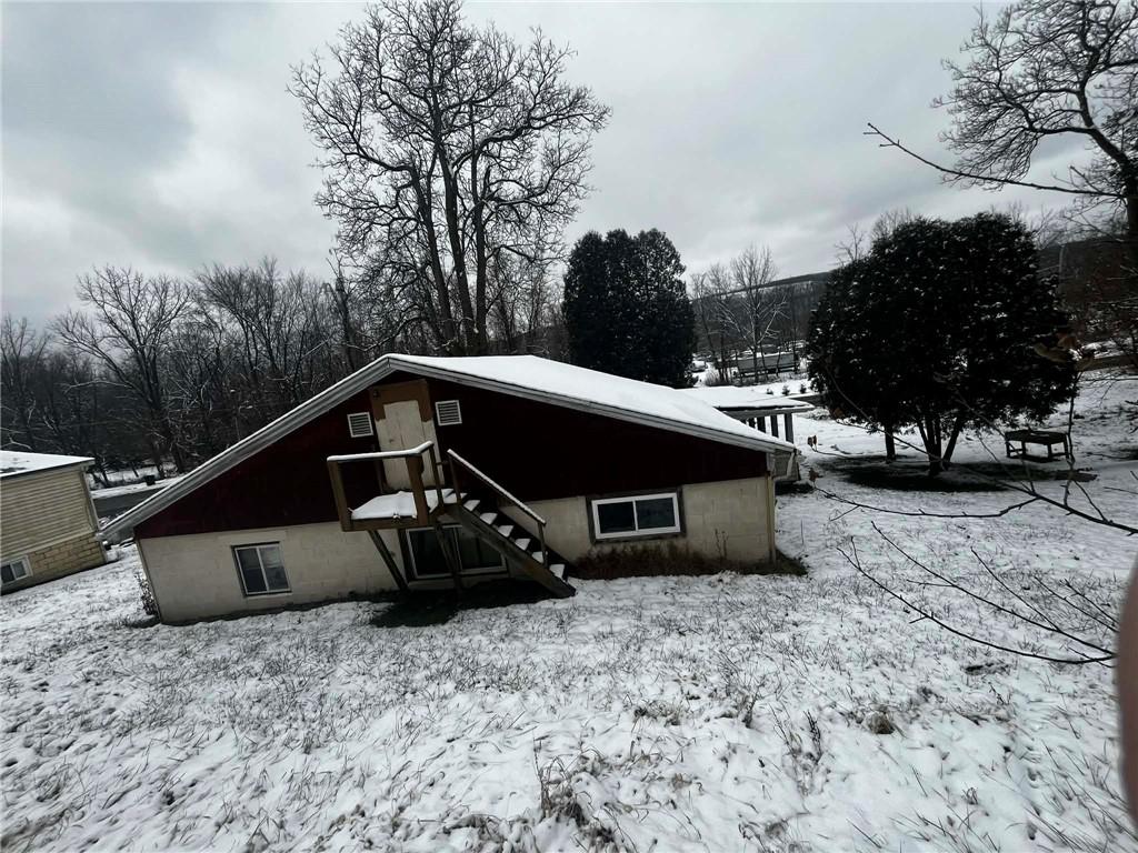 612 State Rte 1031 Templeton, PA 16259 - Photo 25 of 26 a roof deck with table and chairs under an umbrella with large trees