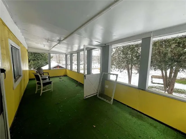 a view of an chairs and table in a balcony