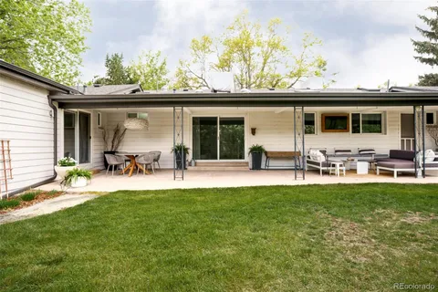 a view of a backyard with a patio