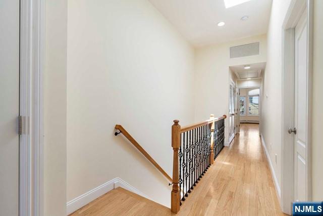 212 Slocum Way, Unit A Fort Lee, NJ 07024 - Photo 15 of 30 a view of a hallway with wooden floor and staircase