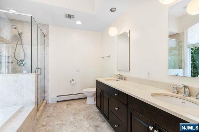 212 Slocum Way, Unit A Fort Lee, NJ 07024 - Photo 18 of 30 a bathroom with a double vanity sink mirror and double