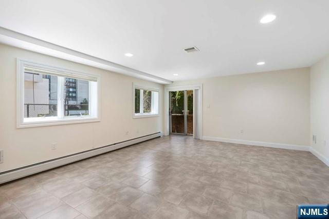 212 Slocum Way, Unit A Fort Lee, NJ 07024 - Photo 25 of 30 a view of an empty room with a window