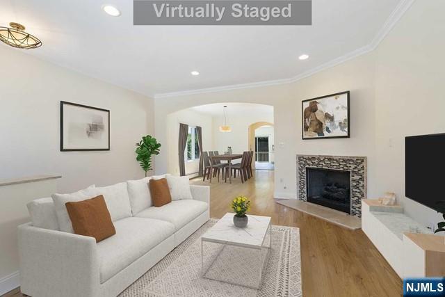 212 Slocum Way, Unit A Fort Lee, NJ 07024 - Photo 3 of 30 a living room with furniture and a fireplace