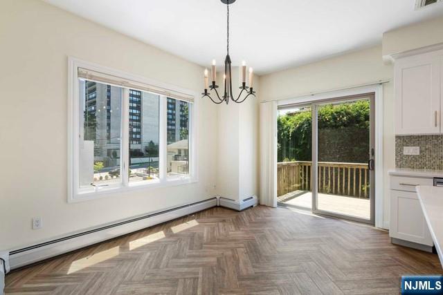 212 Slocum Way, Unit A Fort Lee, NJ 07024 - Photo 8 of 30 a view of empty room with wooden floor and fan