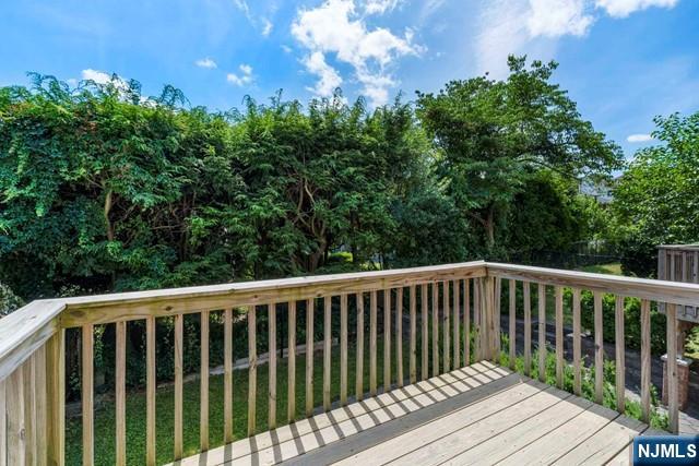 212 Slocum Way, Unit A Fort Lee, NJ 07024 - Photo 9 of 30 a balcony with wooden floor and fence