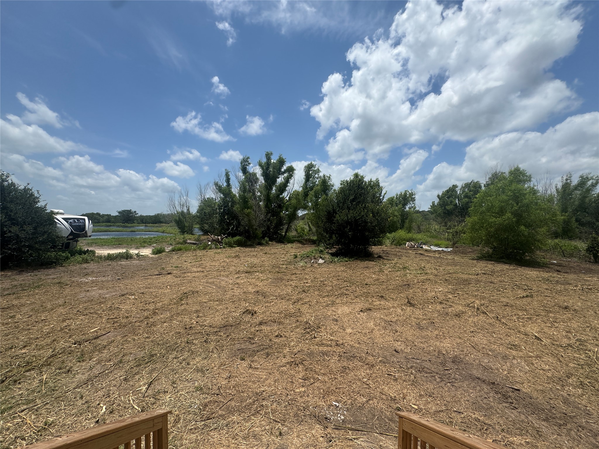 7855 Taylorsville Road Dale, TX 78616 - Photo 11 of 11 A tranquil pond view awaits from this expansive, undeveloped lot, ready for your vision.
