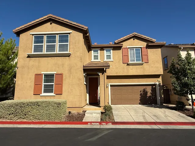 a front view of a house with yard