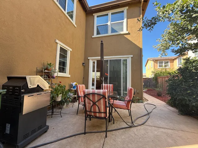 a view of a balcony with chairs