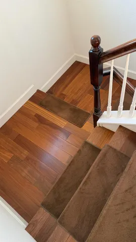a view of a patio with a dining table and chairs