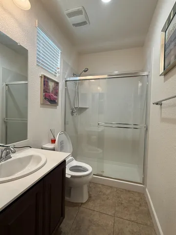 a kitchen with stainless steel appliances a sink a stove top oven a counter space and cabinets