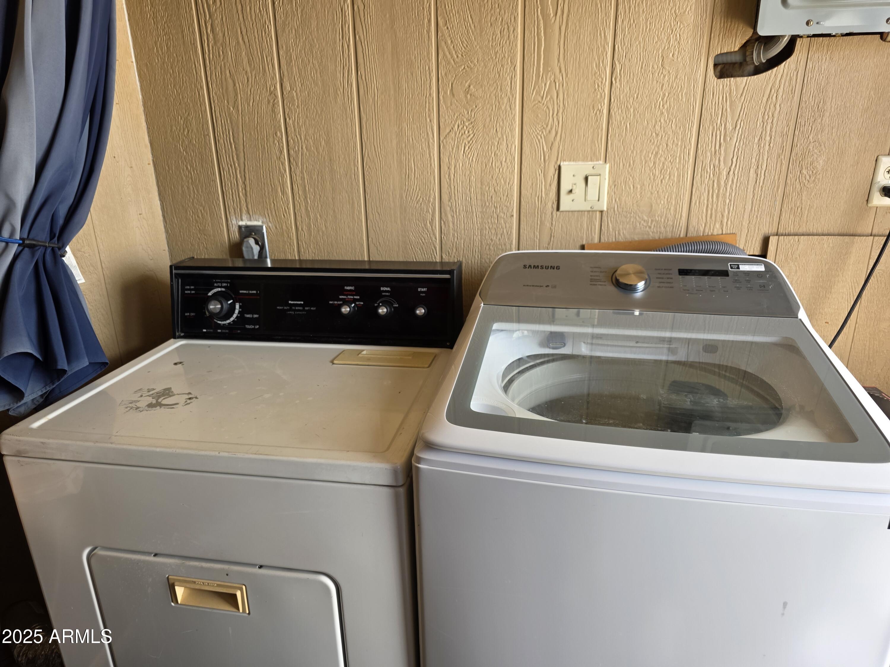 1457 South Zuni Avenue, Unit 457 Apache Junction, AZ 85119 - Photo 12 of 12 a utility room with dryer and washer