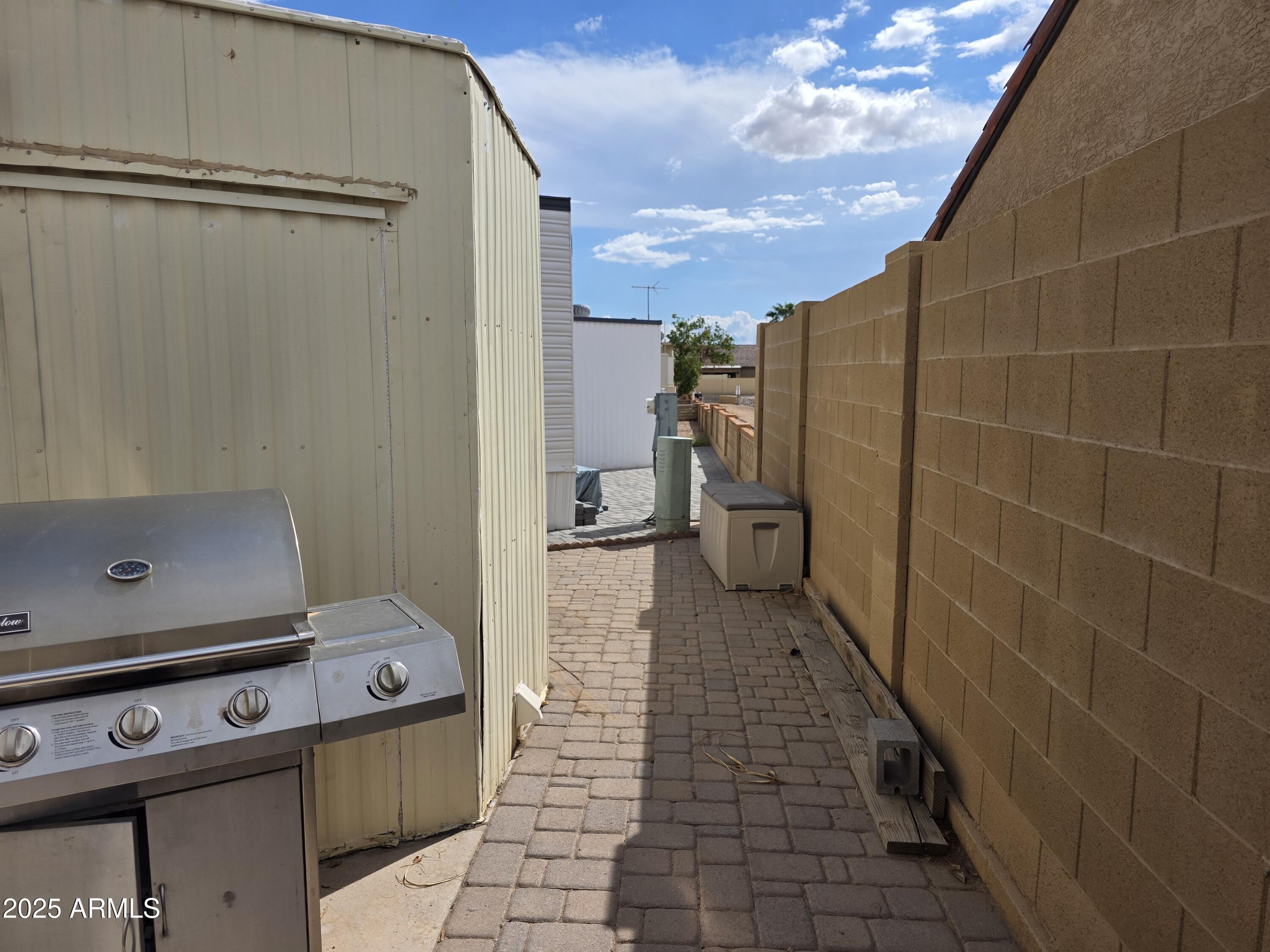 1457 South Zuni Avenue, Unit 457 Apache Junction, AZ 85119 - Photo 4 of 12 a bathroom with a shower