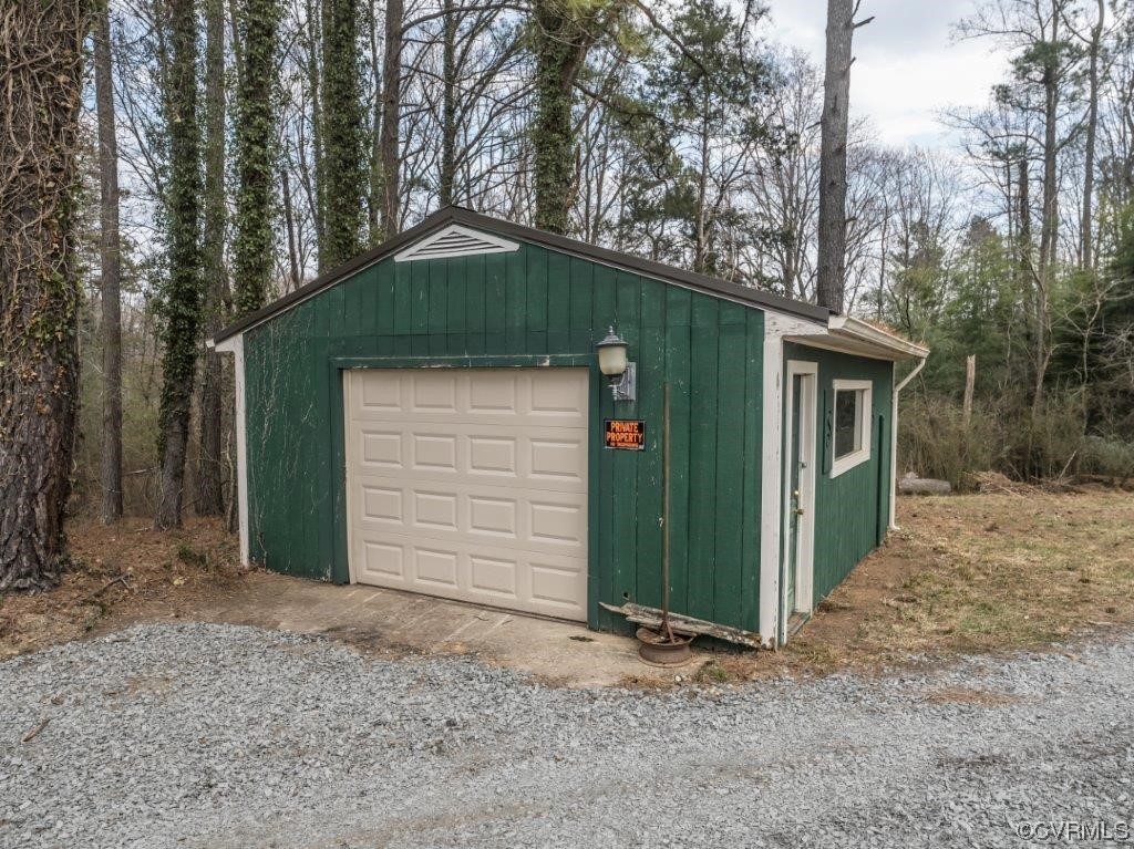 134 Ampthill Road Cartersville, VA 23027 - Photo 18 of 50 a front view of a house with a yard and garage