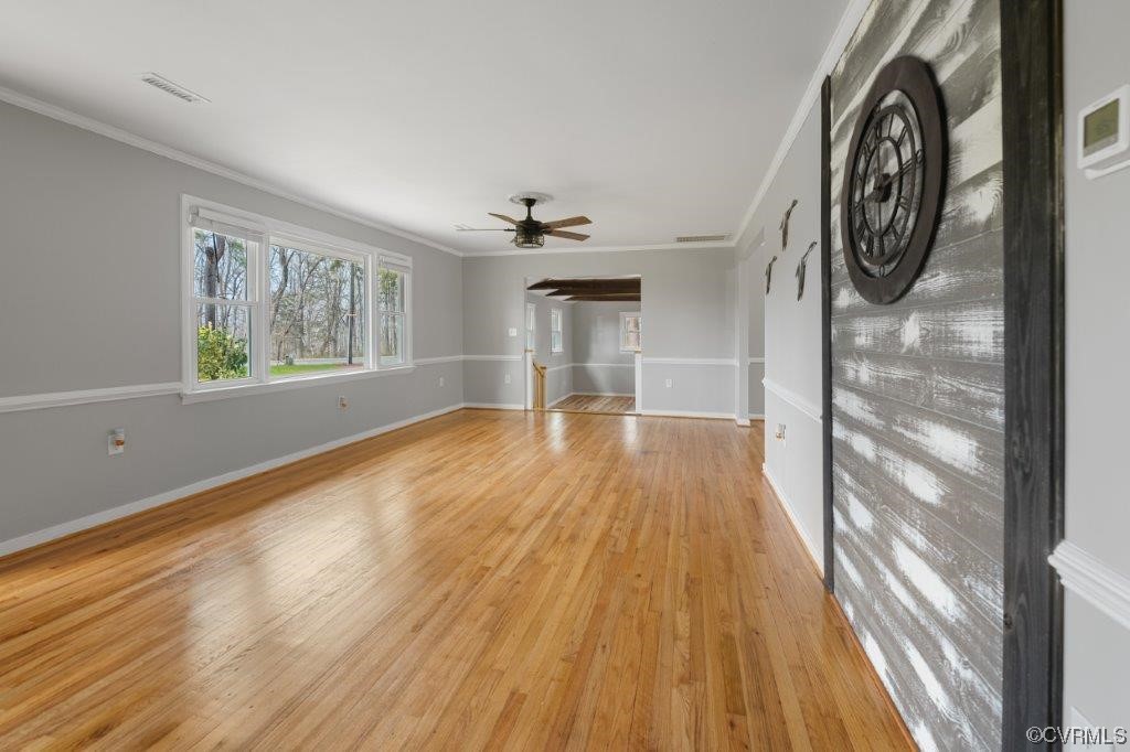134 Ampthill Road Cartersville, VA 23027 - Photo 20 of 50 a view of empty room with wooden floor and fan