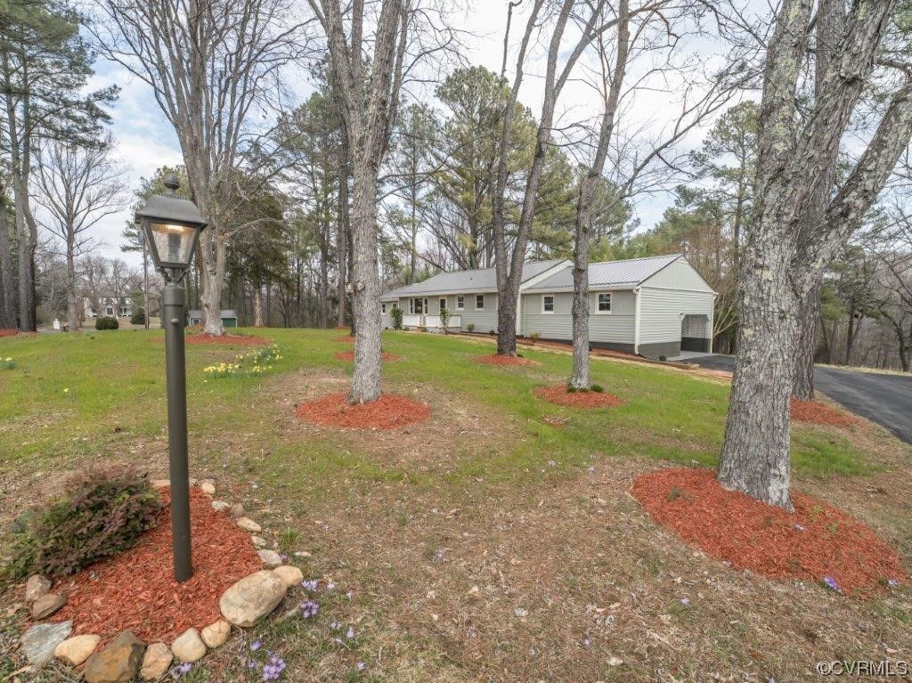 134 Ampthill Road Cartersville, VA 23027 - Photo 2 of 50 a view of a house with backyard and trees
