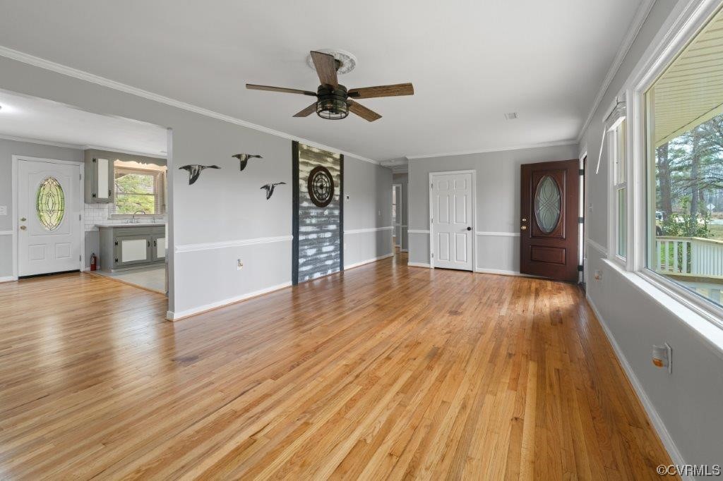 134 Ampthill Road Cartersville, VA 23027 - Photo 21 of 50 a view of empty room with wooden floor and window