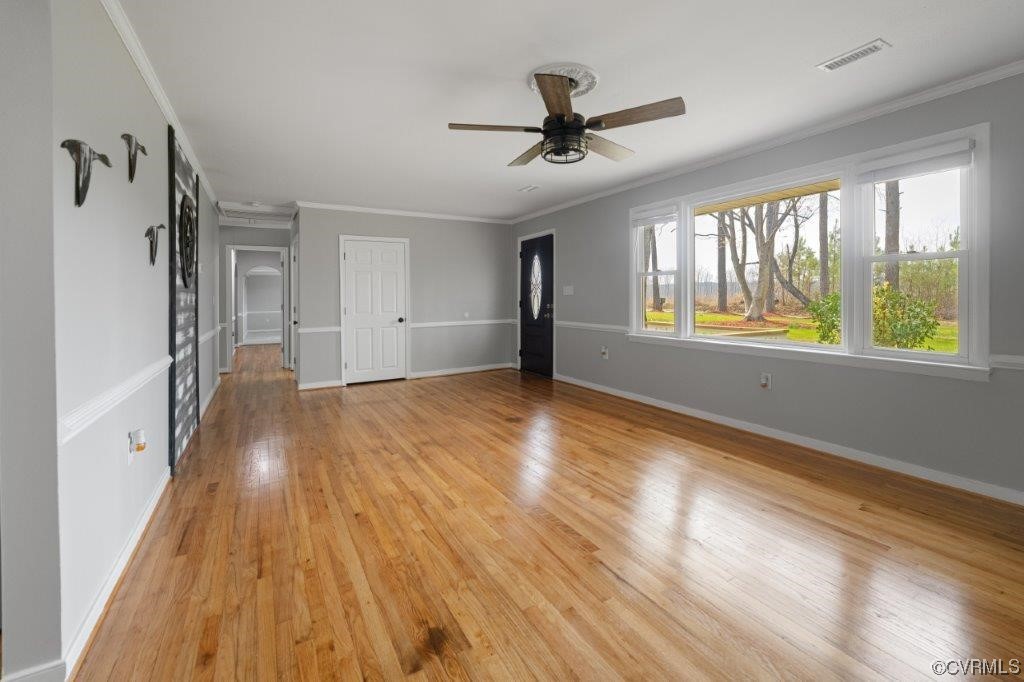 134 Ampthill Road Cartersville, VA 23027 - Photo 22 of 50 a view of empty room with wooden floor and fan