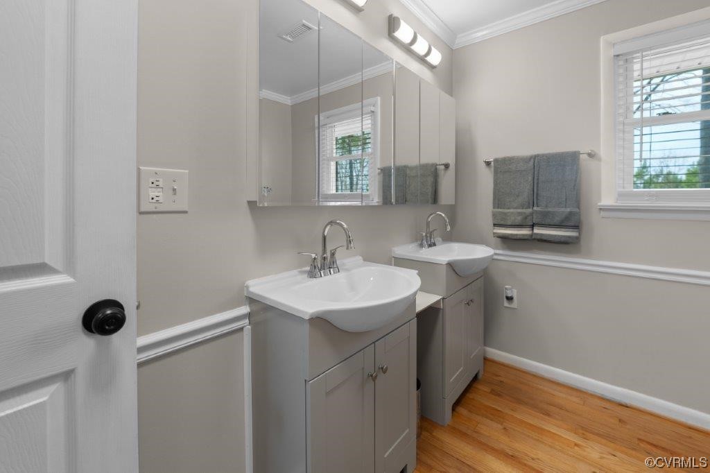 134 Ampthill Road Cartersville, VA 23027 - Photo 31 of 50 a bathroom with a sink a toilet a mirror and window
