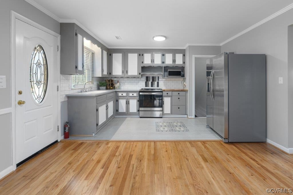 134 Ampthill Road Cartersville, VA 23027 - Photo 40 of 50 a large kitchen with stainless steel appliances granite countertop a stove and a refrigerator