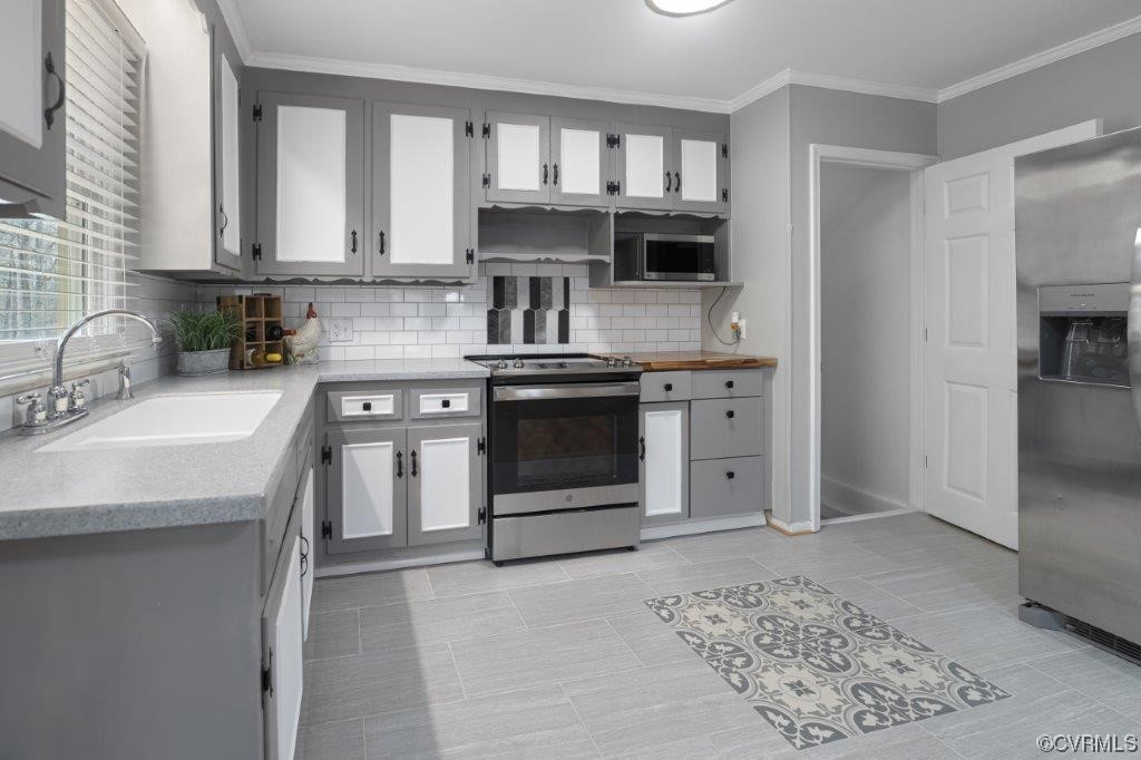 134 Ampthill Road Cartersville, VA 23027 - Photo 42 of 50 a kitchen with stainless steel appliances granite countertop a sink stove and refrigerator