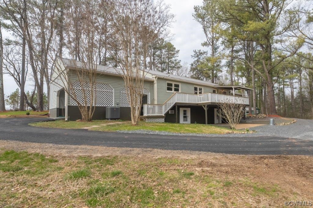 134 Ampthill Road Cartersville, VA 23027 - Photo 7 of 50 a view of a house with a yard and large trees