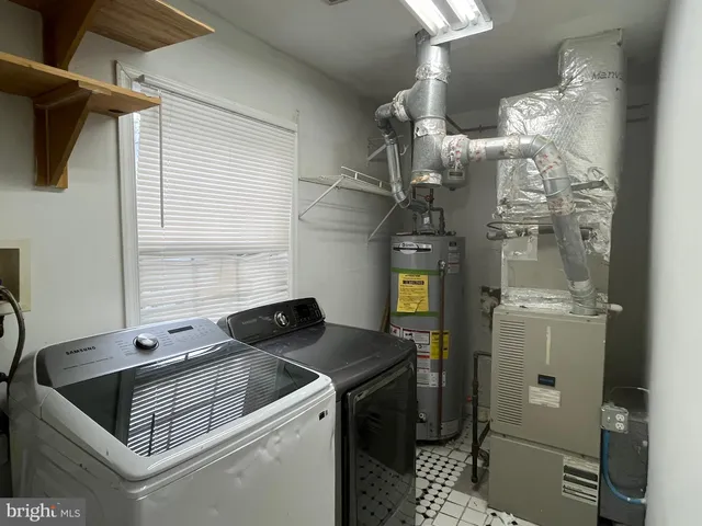 a kitchen that has a sink and a stove