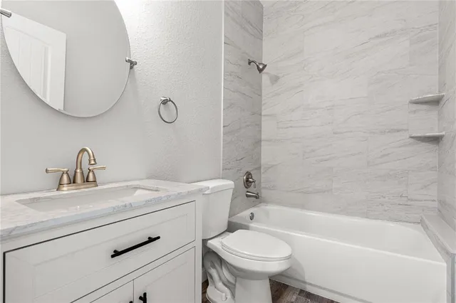 a bathroom with a sink toilet and bathtub