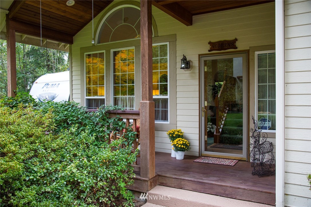 22705 Peter Grubb Road Southeast Renton, WA 98058 - Photo 2 of 40 a front view of a house with a garden