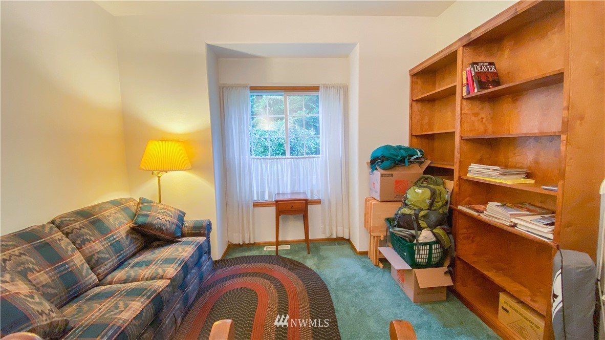 22705 Peter Grubb Road Southeast Renton, WA 98058 - Photo 12 of 40 a living room with furniture and a lamp