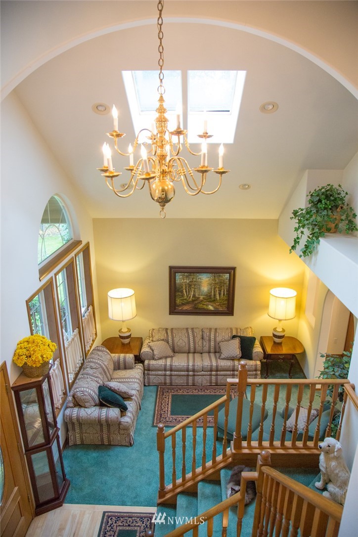 22705 Peter Grubb Road Southeast Renton, WA 98058 - Photo 13 of 40 a view of a livingroom with furniture hardwood floor and windows
