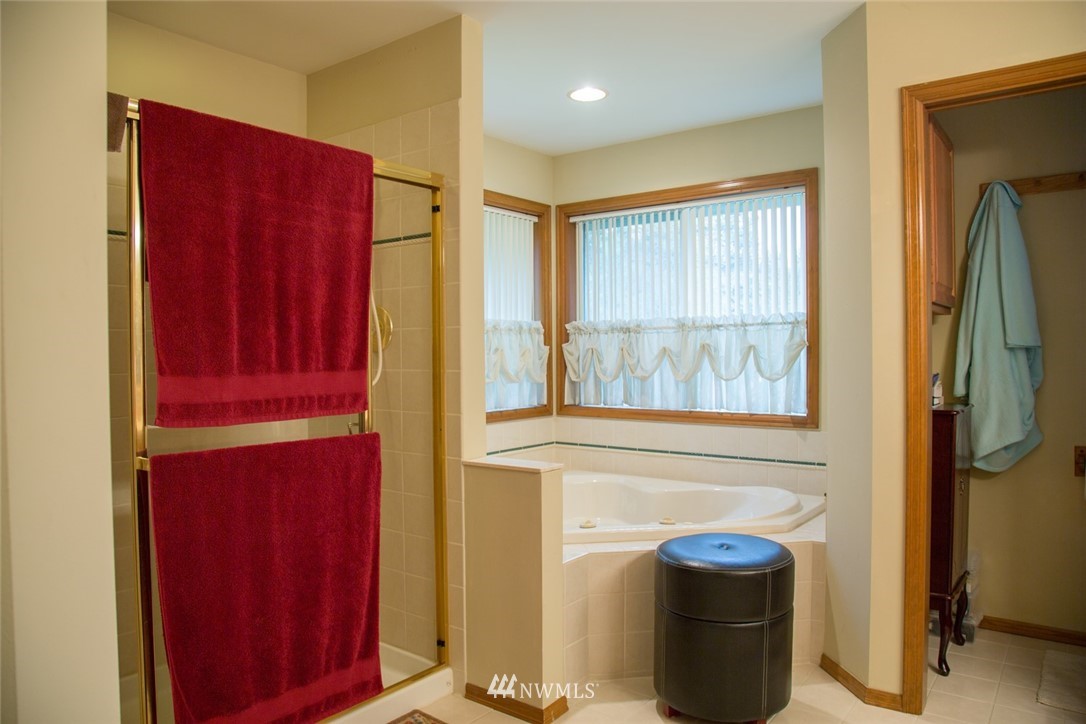 22705 Peter Grubb Road Southeast Renton, WA 98058 - Photo 19 of 40 a view of walk in closet with empty racks and a window