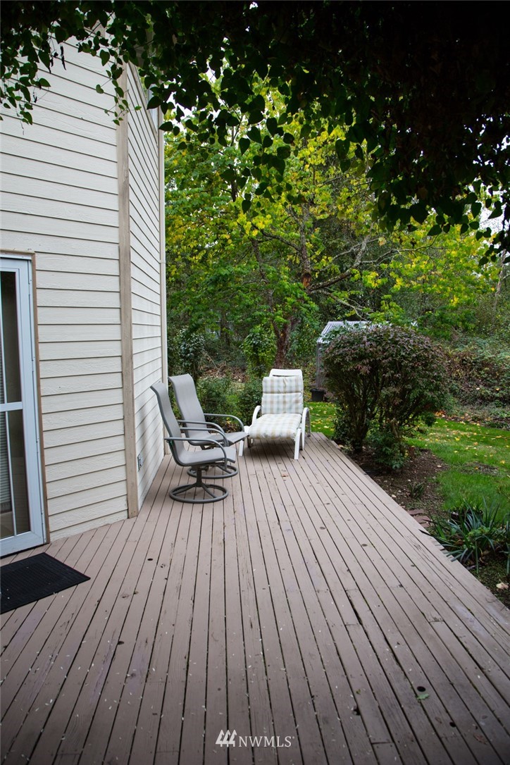 22705 Peter Grubb Road Southeast Renton, WA 98058 - Photo 27 of 40 a view of backyard with a deck and wooden floor