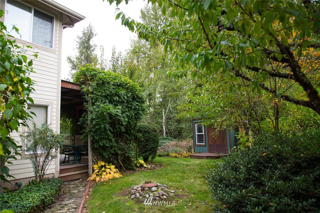 22705 Peter Grubb Road Southeast Renton, WA 98058 - Photo 29 of 40 a view of a garden with a fountain