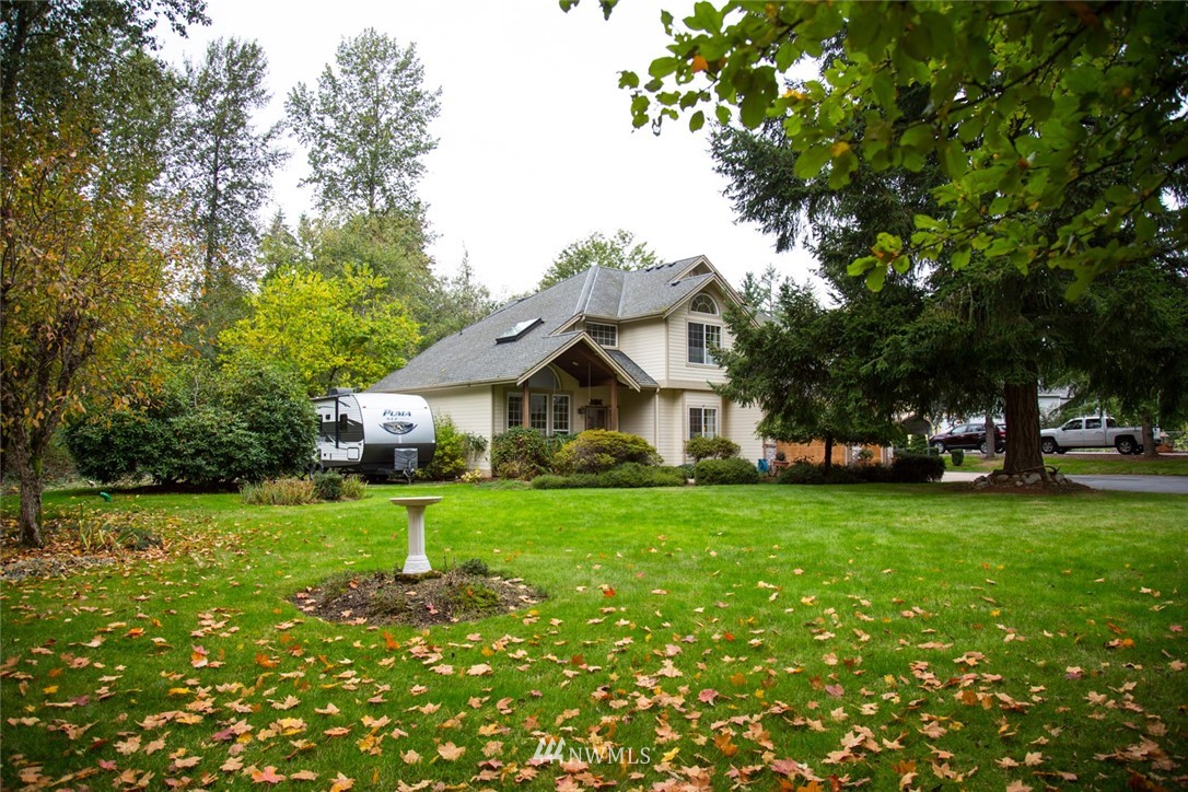 22705 Peter Grubb Road Southeast Renton, WA 98058 - Photo 31 of 40 a front view of a house with a yard