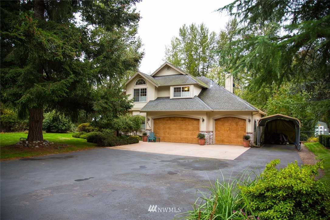 22705 Peter Grubb Road Southeast Renton, WA 98058 - Photo 39 of 40 a view of a house with a yard and large tree