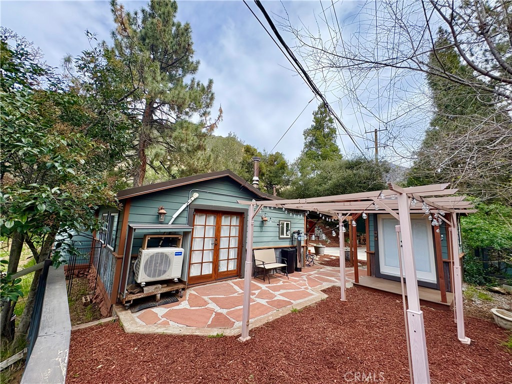 36750 Hilltop Road Yucaipa, CA 92399 - Photo 2 of 27 a front view of a house with a yard