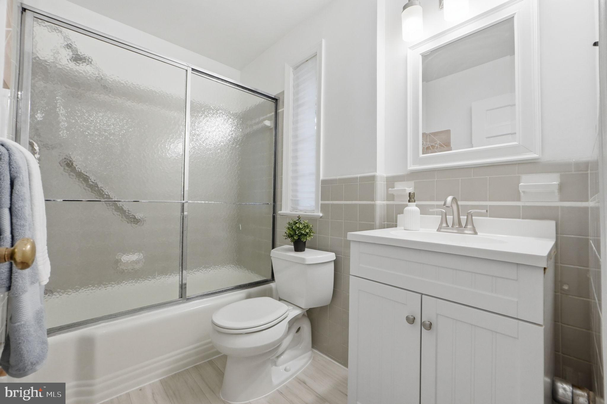 5910 Overlea Road Bethesda, MD 20816 - Photo 27 of 56 a bathroom with a sink toilet and shower