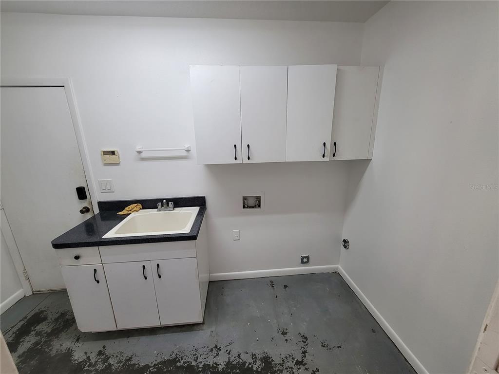 37515 Phelps Road Zephyrhills, FL 33541 - Photo 11 of 25 a room with cabinets