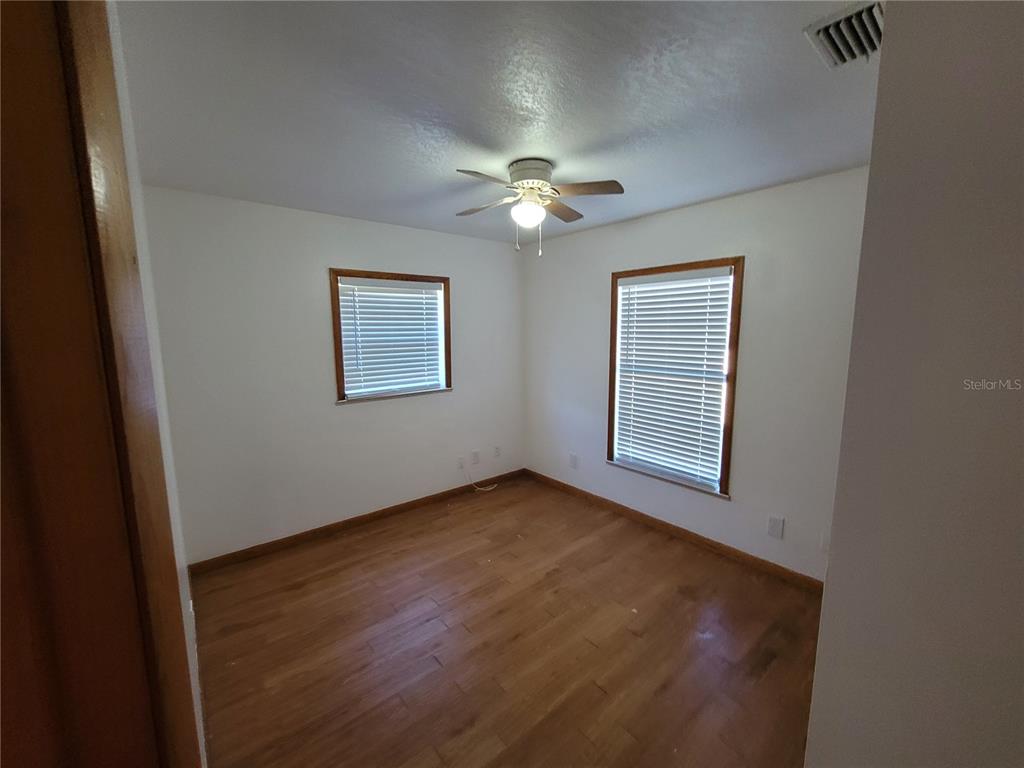 37515 Phelps Road Zephyrhills, FL 33541 - Photo 17 of 25 a view of an empty room with a window