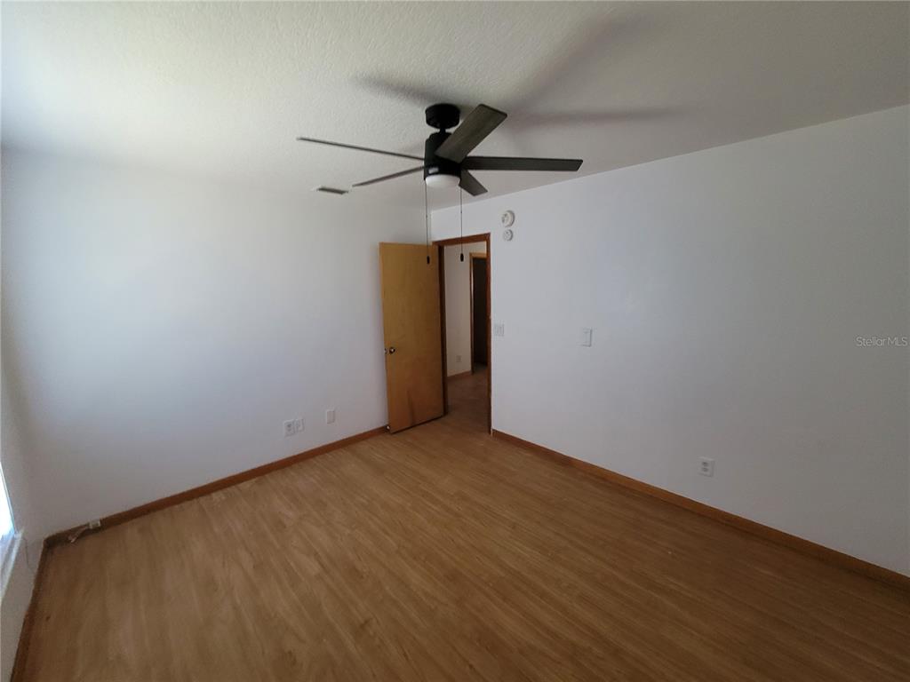 37515 Phelps Road Zephyrhills, FL 33541 - Photo 24 of 25 a view of a room with a sink and wooden floor