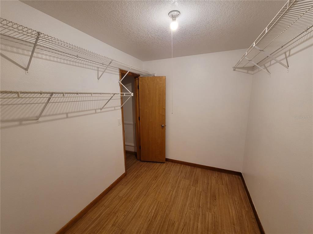 37515 Phelps Road Zephyrhills, FL 33541 - Photo 25 of 25 a view of a room with wooden floor