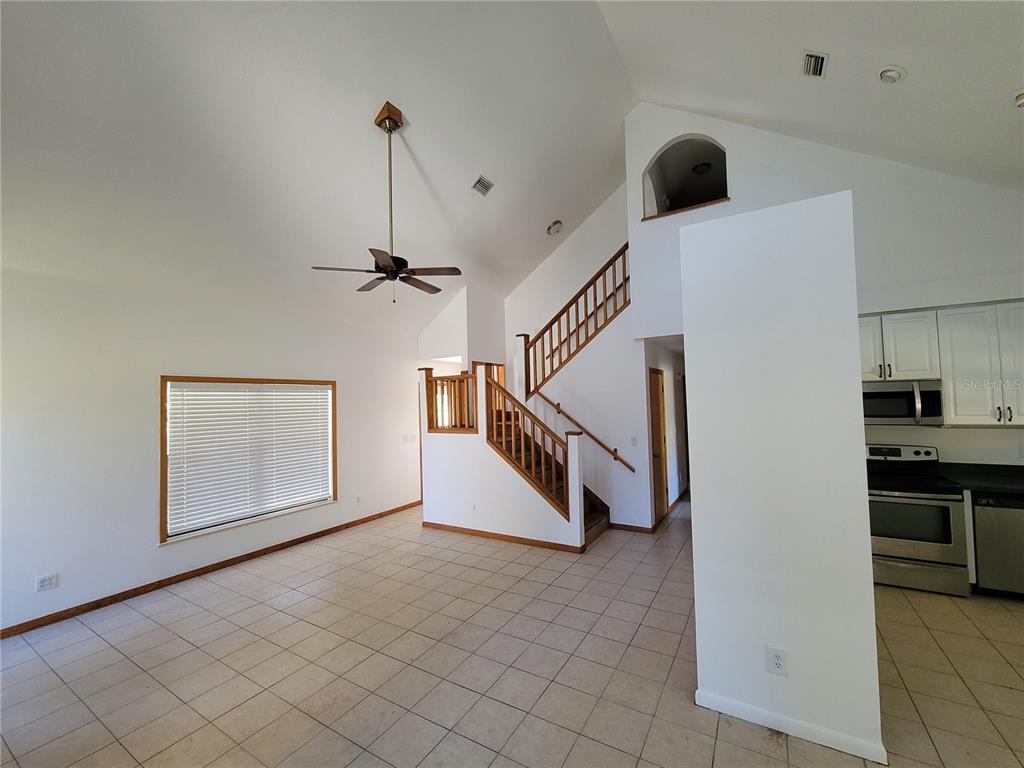 37515 Phelps Road Zephyrhills, FL 33541 - Photo 10 of 25 a view of a livingroom with a ceiling fan and window