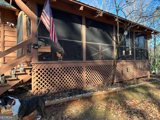 a side view of a house with a street